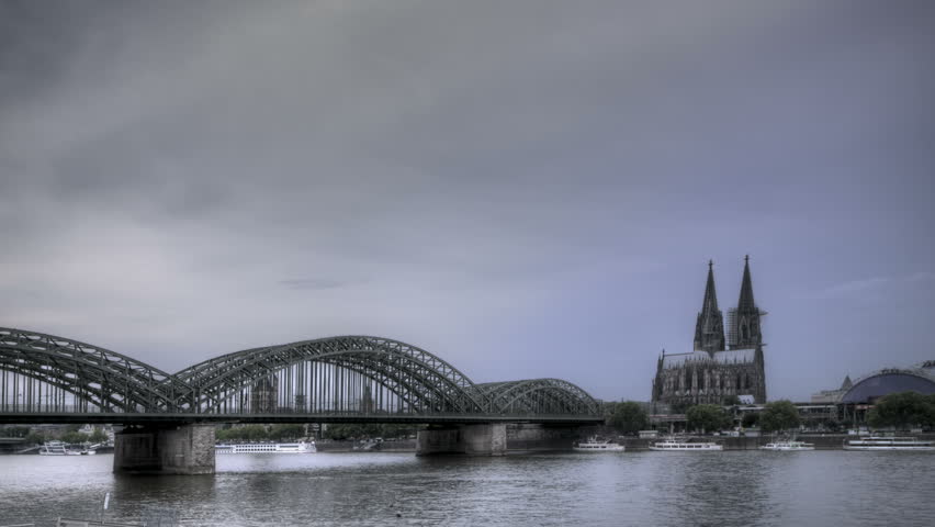 HDR Time lapse Riverside view of the Cologne Cathedral and railway bridge over