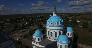 Aerial drone video of old church in Yaroslavl Oblast area in the afternoon, Novoye selo village, located near ancient town of Pereslavl 150 km north-east of Moscow, the capital of Russia