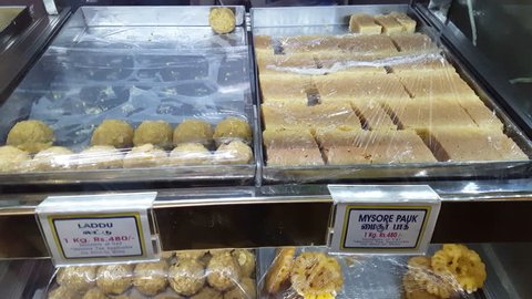 South Indian desserts for sale in restaurant shop, Ladu, Mysore Pauk, India