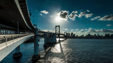 Timelapse view of Rainbow bridge and Tokyo seaside from Tokyo bay