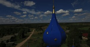 Aerial drone video of old church in Yaroslavl Oblast area in the afternoon, Rahmanovo selo village, located near ancient town of Pereslavl 150 km north-east of Moscow, the capital of Russia