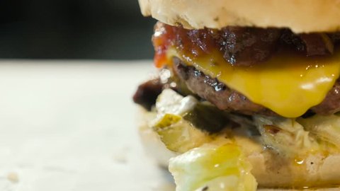 cheeseburger macro with kitchen background, tasty burger close up