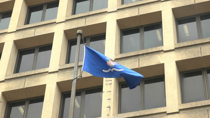 close up of the department of justice flag on the fbi building in washington d.c.