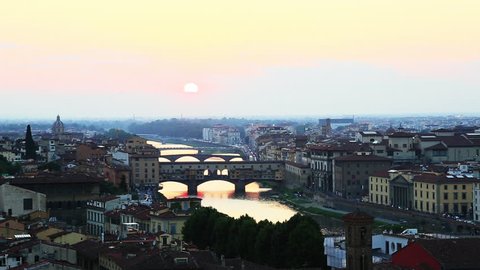 Zoom in shot of a city, Ponte Vecchio, Arno River, Florence, Tuscany, Italy