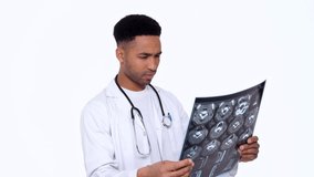 Man doctor trying to understand x-ray image isolated