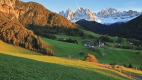 Magnificent view of Santa Maddalena village in front of the Geisler or Odle Dolomites Group. Colorful autumn sunset in Dolomite Alps, Italy, Europe. Full HD video (High Definition).
