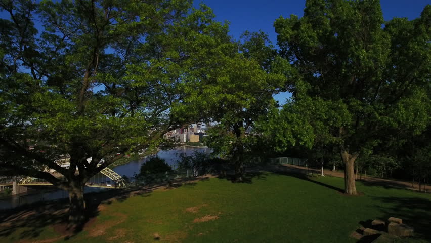 PITTSBURGH - Circa May, 2017 - An early evening slowly rising aerial view of the Pittsburgh, PA skyline as seen from the West End Overlook.	 	