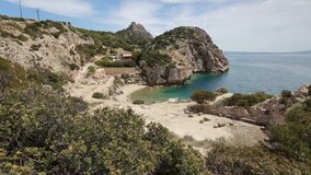 Sunny spring view of West Court of Heraion of Perachora, Limni Vouliagmenis location, Greece, Europe. Full HD video (High Definition).