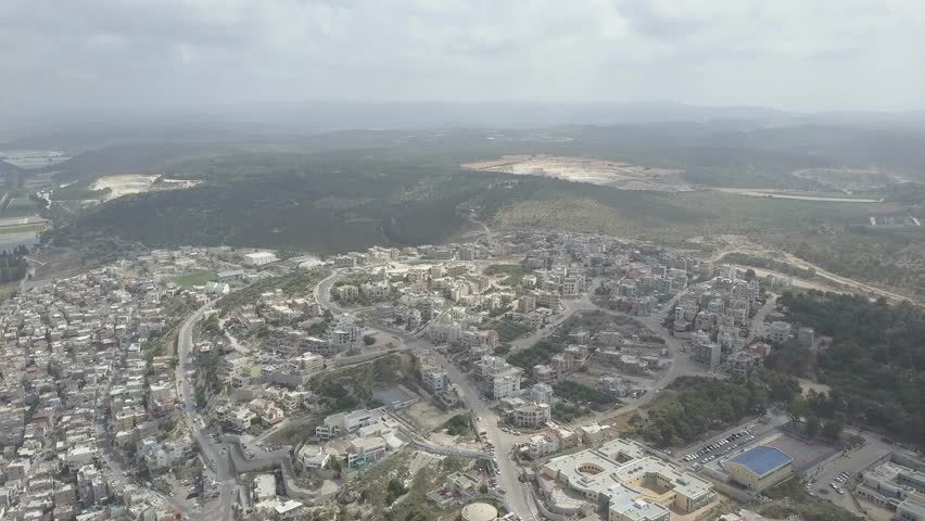 An Arab-Israeli village in northern Israel with steeple - flat