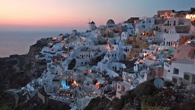 Colorful evening view of Santorini island. Picturesque spring sunset on the famous Greek resort Oia, Greece, Europe. Traveling concept background. Full HD video (High Definition).