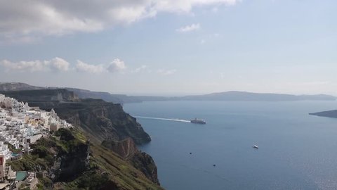 Time laps clip. Sunny morning view of Santorini island. Picturesque spring sunrise on the famous Greek resort Fira, Greece, Europe. Traveling concept background. Full HD video (High Definition).