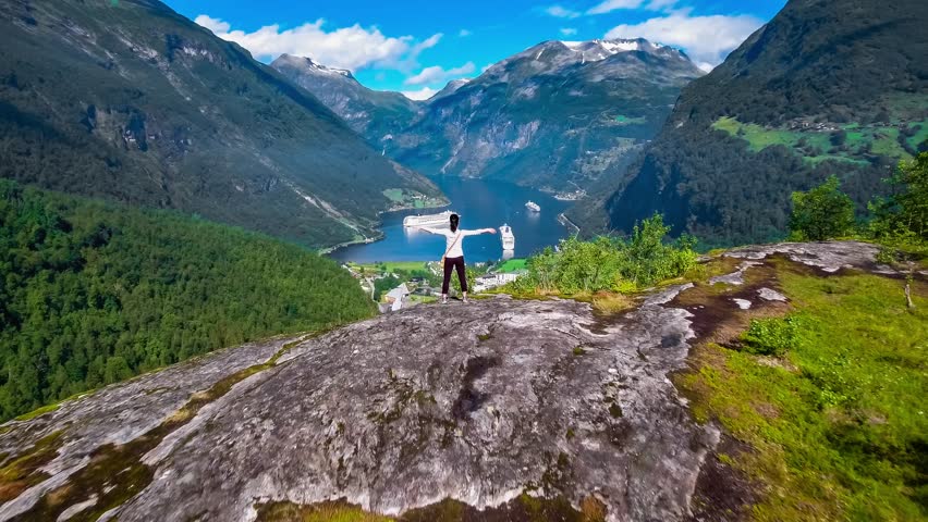 Geiranger fjord, Beautiful Nature Norway panorama. It is a 15-kilometre (9.3 mi) long branch off of the Sunnylvsfjorden, which is a branch off of the Storfjorden (Great Fjord). Royalty-Free Stock Footage #26498111
