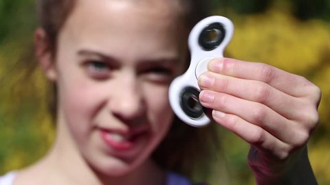Fidget Spinner - Teenage Girl Playing with Crazy Spinner