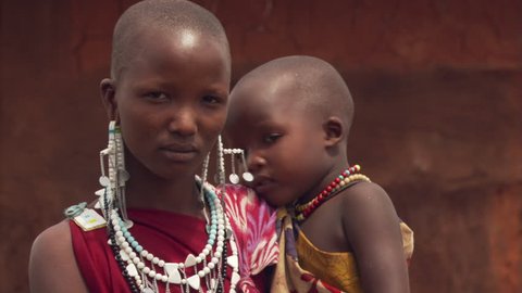 Portrait of young Masai woman and child in Tanzania
