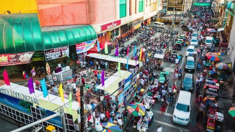 Metro Manila, Philippines - April 23, 2017: Time lapse view over busy street in the Quiapo district of Manila, Philippines.