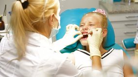 Orthodontist with Little Girl Patient