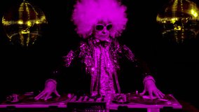 amazing DJ grandma, older woman djing and partying in a disco setting. these retired rockers will get the party going