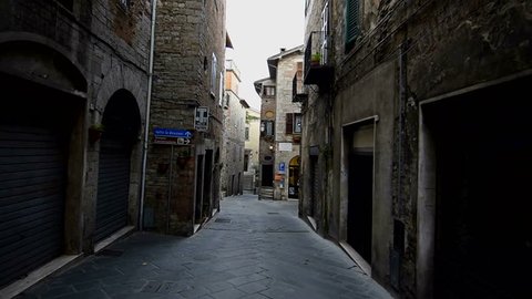 Todi, November 2016: Narrow old italien street, dolly shot. Historic old town of Todi. Todi is a more than 2000 year old city in Umbria.