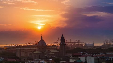 Time lapse view of sunset over the Manila Cathedral in Intramuros, Metro Manila, Philippines - zoom out. 