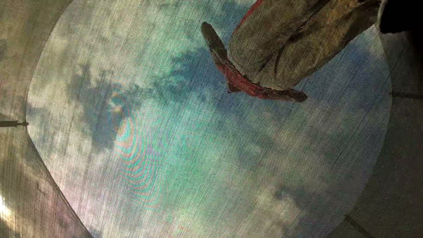 Woman jumping on a trampoline, a bottom view