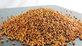 Grains of buckwheat on the table that rotates. Video food 360