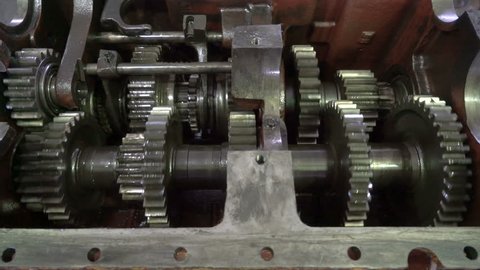 Open gearbox. Gears rotate. Transmission check and repair.Transmission gears closeup detail.