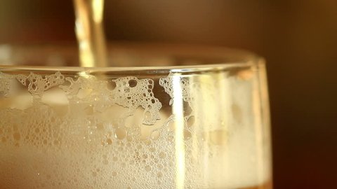 Pouring beer into a glass. close up.
 Stock Video