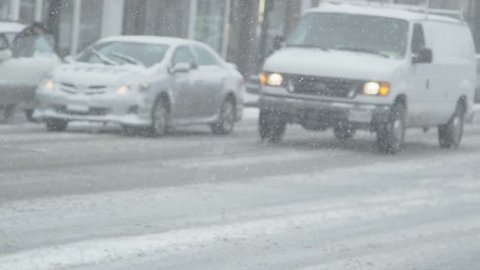 busy intersection in heavy snow