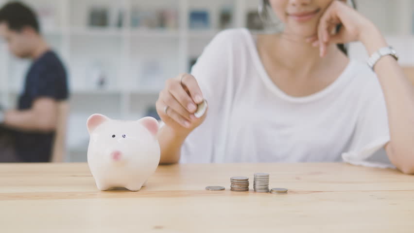 Coin stacked saving concept.piggy bank saving money.Business saving money concept.