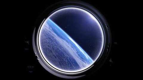 A view of the Earth from through the porthole of a spaceship. International space station is orbiting the Earth. Space, earth, orbit, ISS.