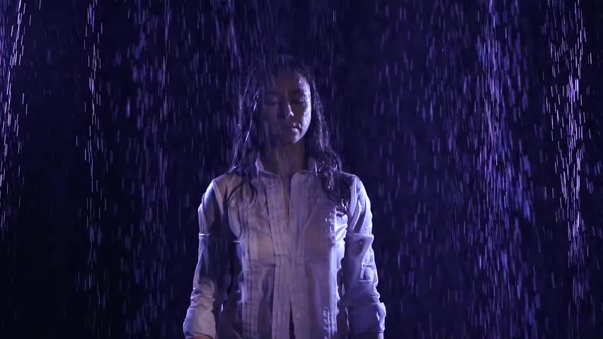 Soaking Wet Woman Standing In The Pouring Rain In The Dark