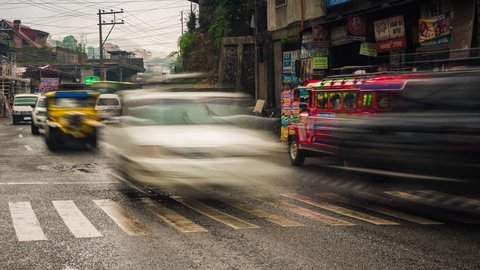 La Trinidad, Philippines - May 02, 2017: Time lapse view of traffic in La Trinidad near Baguio City, northern Luzon, Philippines. 