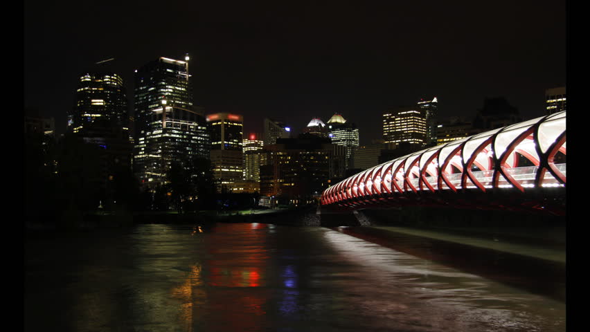 This is a night time lapse scenic featuring downtown Calgary, Peace Bridge, and