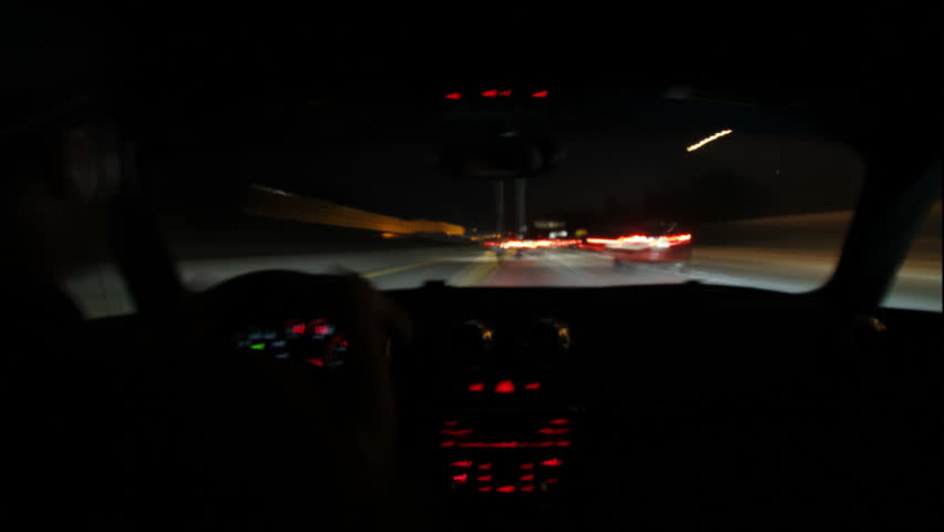 High speed, long exposure time lapse shot of a night commute on the freeways of