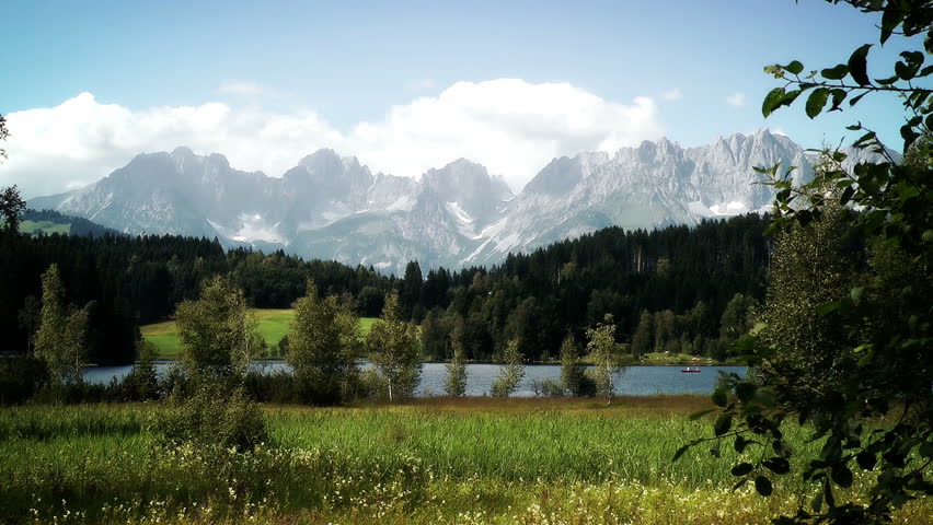 Mountain And Lake Panoramic View stock footage. The Austrian Alps in the