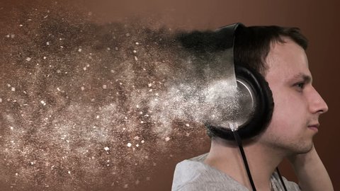 Profile of a man with headphones, isolated. Particles of damage from headphones LOOP animation