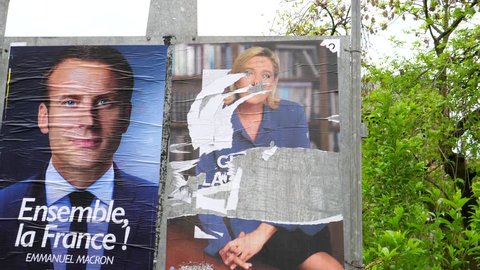 STRASBOURG, FRANCE - MAY 7, 2017: Le Pen damaged poster during the second round of the French presidential election to choose between Emmanuel Macron and Marine Le Pen