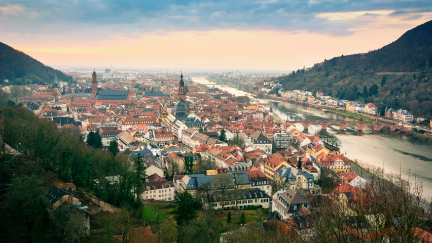 Heidelberg, Germany, timelapse footage of aerial view, with dreamy dusk sky, evening lights and Neckar river