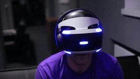 Man plays VR video game.