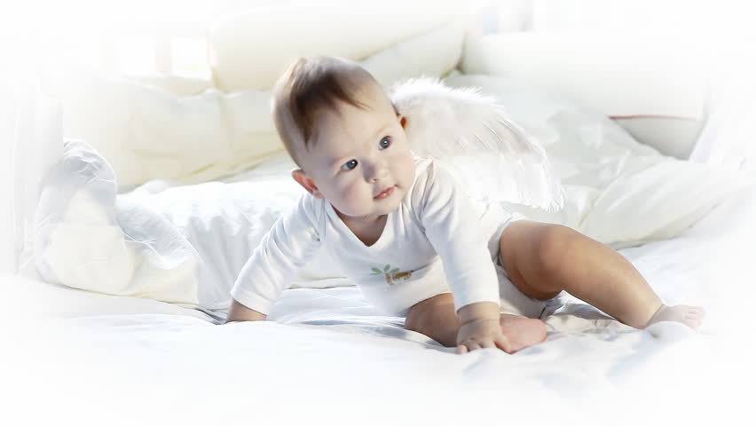 Baby angel on the bed