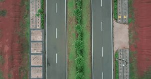 Video footage of bird view of two empty roads in the empty residential land. Professional shot in 4K resolution