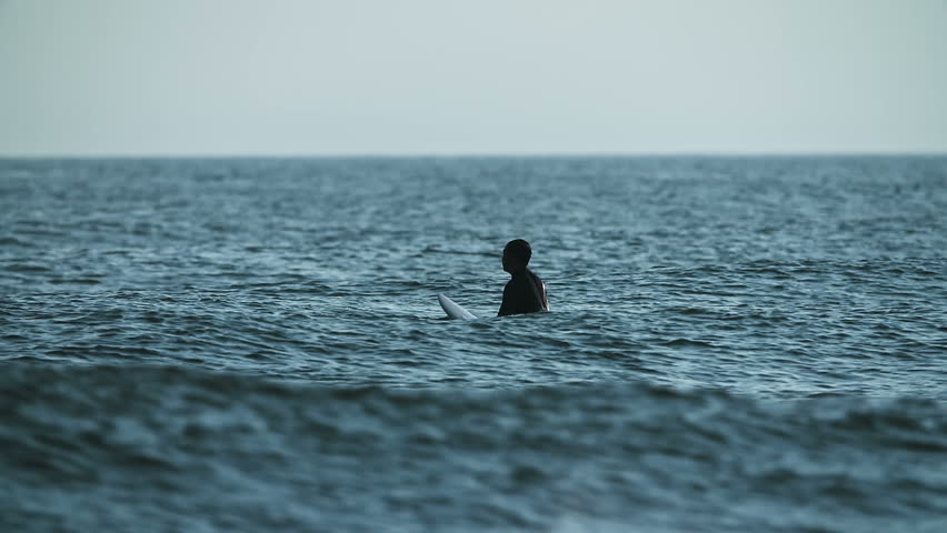 Slow Motion, Surfer Waiting for Wave