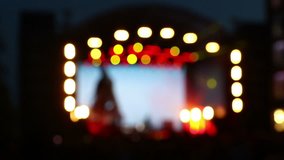 Blurred bokeh: defocused shimmering background of a concert lighting on stage