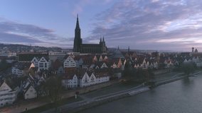 Ulm, Germany - March 11, 2017: 4K Drone Clip from Ulm historic center and Minster at sunrise. Clip with double speed. Graded footage.