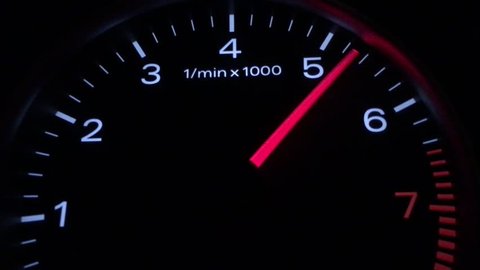 Car speedometer and moving,featuring lights leaks, a speedometer, and long exposure time lapse traffic,Abstract night driving montage,The car pics up speed, Rounds Per Minute Display Informations car,