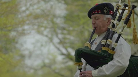 A view of Revolutionary War era piper playing bagpipes