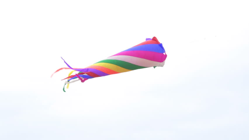 Kite flying in the shape Large rainbow flies in the sky.