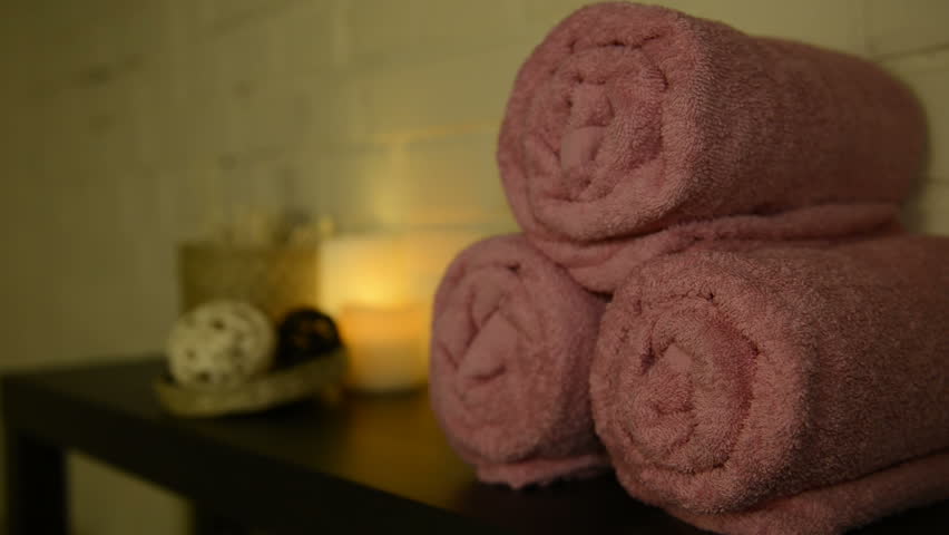 Interior details in a Spa. Towel and candle on a table | Shutterstock HD Video #26622871