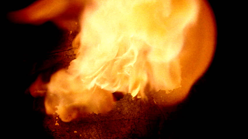Paper wipe: burns outward from center of frame