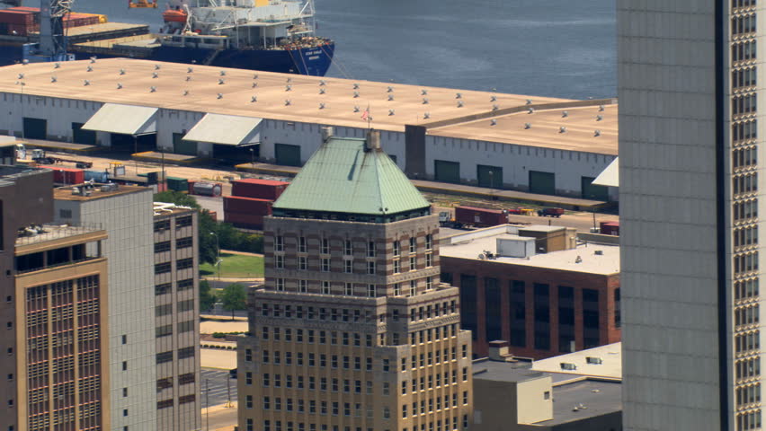 Close flight past skyscrapers near waterfront in Mobile, Alabama. Shot in 2007.